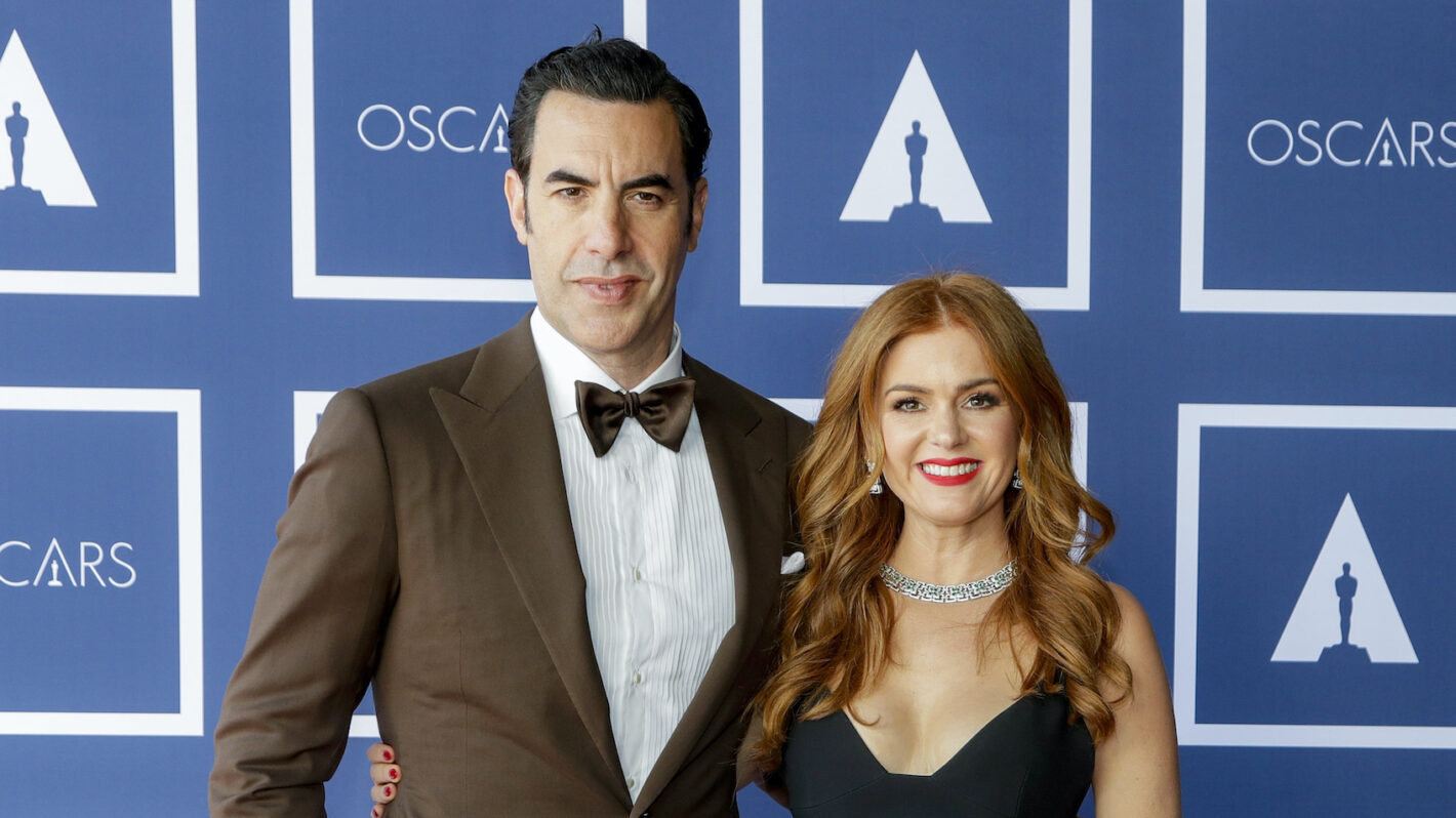 Sacha Baron Cohen and Isla Fisher pose for a photo during a screening of the Oscars on Monday April 26, 2021 in Sydney, Australia.